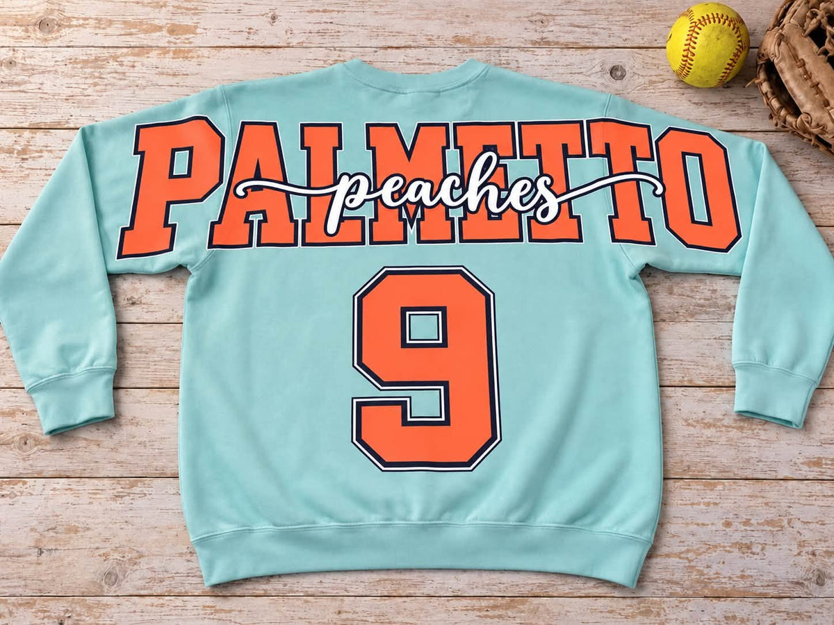 Aqua Palmetto Peaches softball crewneck sweatshirt with orange varsity lettering and large number nine on full back