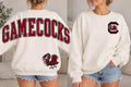 Cream South Carolina Gamecocks sweatshirt with garnet varsity Gamecocks back lettering, gamecock graphic, and block C gamecock left-chest design